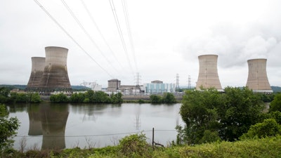 In this May 22, 2017 file photo shown is the Three Mile Island nuclear power plant in Middletown, Pa. With nuclear power plant owners seeking a rescue in Pennsylvania, a number of state lawmakers are signaling that they are willing to help, with conditions. Giving nuclear power plants what opponents call a bailout could mean a politically risky vote to hike electric bills.
