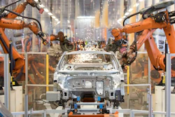 In this Saturday, March 9, 2019 file photo robots work on a VW Passat car at a plant of the car manufacturer Volkswagen in Emden, Germany.
