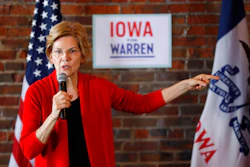 In this March 1, 2019, file photo, Democratic presidential candidate Sen. Elizabeth Warren speaks to local residents during an organizing event in Dubuque, Iowa. Warren is everywhere in the first three months of her presidential campaign: 11 states as of Tuesday. But where she's not is at the top of early 2020 polls.