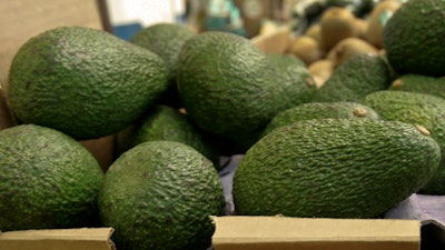 In this Jan. 17, 2007 file photo, California-grown avocados are for sale at a market in Mountain View, Calif. Henry Avocado, a grower and distributor based near San Diego, said Saturday, March 23, 2019, they are voluntarily recalling their California grown 'Henry' labeled whole avocados distributed across the U.S. over possible listeria contamination. Henry Avocado says it issued the voluntary recall after a routine inspection of its packing plant revealed samples that tested positive for listeria. The company says avocados imported from Mexico and distributed by Henry are not being recalled and are safe. There have been no reports of any illnesses associated with the items.