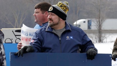 Chuck Rodriguez, a 19-year employee, protests outside the plant, Wednesday, March 6, 2019, in Lordstown, Ohio. General Motors' sprawling Lordstown assembly plant near Youngstown is ending production of the Chevrolet Cruze sedan, ending for now more than 50 years of auto manufacturing at the site.