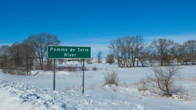 In a Feb. 28, 2019 photo, The Pomme de Terre River flows through the city of Morris, Minn. The city's wastewater treatment plant is discharging too much chloride into the river, largely due to water softeners.