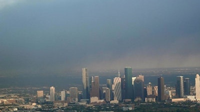 A plume of smoke from a petrochemical fire at the Intercontinental Terminals Company is shown over downtown Houston Monday, March 18, 2019. The large fire at the Houston-area petrochemicals terminal will likely burn for another two days, authorities said Monday, noting that air quality around the facility was testing within normal guidelines.