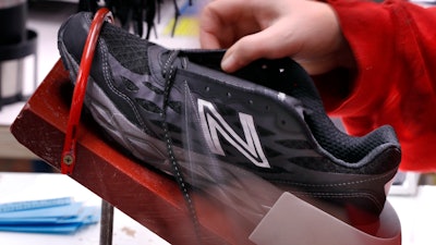 In this Dec. 17, 2018, file photo, a pair of athletic shoes designed for the military are laced up at a New Balance factory in Norridgewock, Maine. On Friday, March 1, 2019, the Institute for Supply Management, a trade group of purchasing managers, issues its index of manufacturing activity for February.