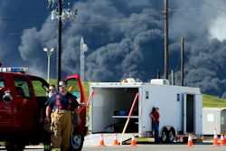 Firefighters arrive at the site where the Intercontinental Terminals Company petrochemical fire reignited, Friday, March 22, 2019, in Deer Park, Texas. The efforts to clean up a Texas industrial plant that burned for several days this week were hamstrung Friday by a briefly reignited fire and a breach that led to chemicals spilling into the nearby Houston Ship Channel.
