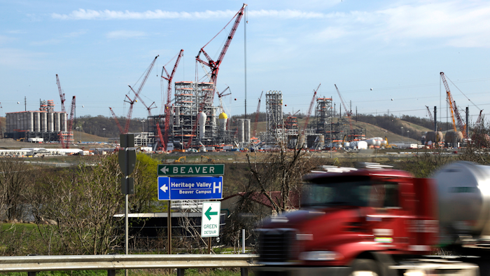 In this April 18, 2019 file photo a tanker truck passes a petrochemical plant being built on the banks of the Ohio River in Monaca, Pa., for the Royal Dutch Shell company. The plant, which is capable of producing 1.6 million tons of raw plastic annually, is expected to begin operations by 2021.