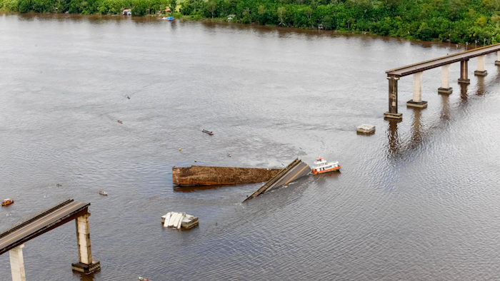 This photo shows a ferry boat which collided with a bridge pillar causing part of the bridge to collapse in the Moju river, in the Brazilian state of Para.