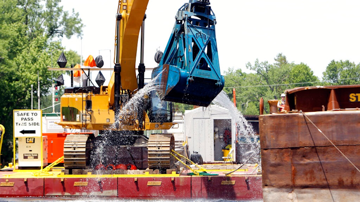 In this June 10, 2011 file photo, crews dredge the Hudson River in Fort Edward, N.Y. The work is part of a project on the upper-Hudson to clean up PCBs released by General Electric decades ago. The Environmental Protection Agency is poised to make an announcement Thursday, April 11, 2019, on GE's $1.7 billion Hudson River cleanup.