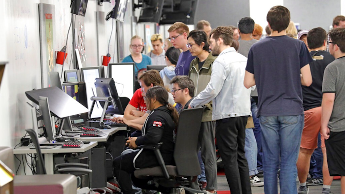 People play new video games during the Entertainment Arts and Engineering Program Launch event at the Master Games Studio on the University of Utah campus Wednesday, April 24, 2019, in Salt Lake City. Drones ferrying medical supplies, packages and even pizza could one day be crisscrossing the skies above U.S. cities, and a team at the University of Utah is working with regulators to keep that traffic in check using a video game.