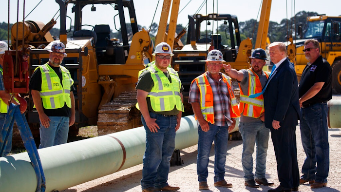 President Donald Trump takes a tour before speaking about energy and infrastructure at the International Union of Operating Engineers International Training and Education Center, Wednesday, April 10, 2019, in Crosby, Texas.