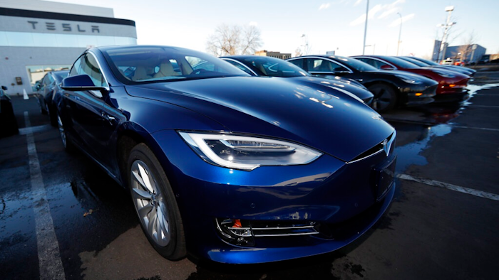 In this Sunday, Feb. 3, 2019, file photograph, an unsold 2019 S75D sits at a Tesla dealership in Littleton, Colo. Tesla's assembly lines slowed down during a rocky start to the new year, which will likely magnify nagging doubts about whether the electric car pioneer will be able to make the leap into mass market.