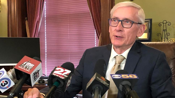Wisconsin Gov. Tony Evers says he thinks it's 'unrealistic' for Foxconn Technology Group to employ 13,000 people in the state and he wants to renegotiate the contract during a news conference Wednesday, April 17, 2019, in Madison, Wisconsin. Evers told reporters that the state was working with Taiwan-based Foxconn to look at revising the original contract for the proposed facility to build liquid crystal display panels because it 'deals with a situation that no longer exists.'