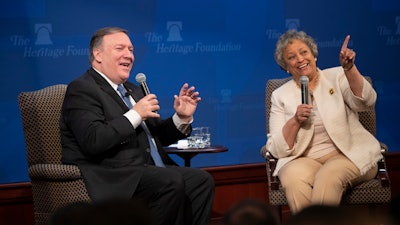 In this May 21, 2018, file photo Secretary of State Mike Pompeo, left, joined by Heritage Foundation President Kay Coles James, speaks at the Heritage Foundation, a conservative public policy think tank, in Washington. Google employees have had more success than other tech workers at demanding change at the company. Google dropped a contract with the Pentagon after employees pushed back on the ethical implications of using company technology to analyze drone video. And after more than 2,400 Google employees signed a petition calling for James to be taken off the board, Google scrapped the board altogether.