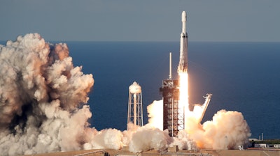 A SpaceX Falcon Heavy rocket carrying a communication satellite lifts off from pad 39A at the Kennedy Space Center in Cape Canaveral, Fla., Thursday, April 11, 2019.