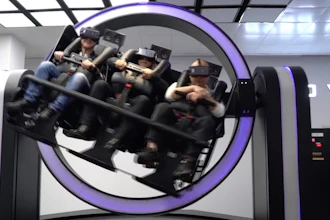 In this April 2, 2019, photo, Liu Zixing, a mining ore businessman, right, rides a virtual reality 'gyroscope' in a VR theme park in Nanchang, China. One of the largest virtual reality theme parks in the world has opened its doors in southwestern China, sporting 42 rides and exhibits from VR bumper cars to VR shoot-em-ups. It's part of an effort by Beijing to get ordinary people excited about the technology - part of a long-term bet that VR will come into widespread use.