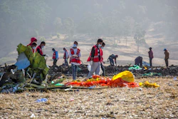 In this March 11, 2019, file photo rescuers work at the scene of an Ethiopian Airlines flight crash near Bishoftu, or Debre Zeit, south of Addis Ababa, Ethiopia. Investigators have determined that an anti-stall system automatically activated before the Ethiopian Airlines Boeing 737 Max jet plunged into the ground, The Wall Street Journal reported Friday, March 29.