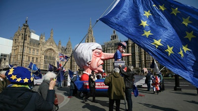 Anti-Brexit demonstrators near College Green at the Houses of Parliament in London.