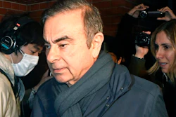 In this April 3, 2019, photo, former Nissan Chairman Carlos Ghosn, center, returns to his residence in Tokyo. Japanese prosecutors said Monday, April 22, 2019, they have indicted Nissan’s former chairman Ghosn with additional charges of breach of trust, with his alleged misconduct expanding outside Japan.