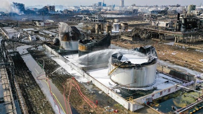 In this file photo taken on March 22, 2019, and released by Xinhua News Agency, foam is sprayed at the site of an explosion at a chemical industrial park in Xiangshui county of Yancheng in eastern China's Jiangsu Province. Authorities are shutting down an eastern China industrial park after 78 people were killed last month by a chemical explosion. The city government said Friday, April 5, 2019 that local departments have met to discuss how to eliminate chemical plants with low safety standards and severe pollution issues.