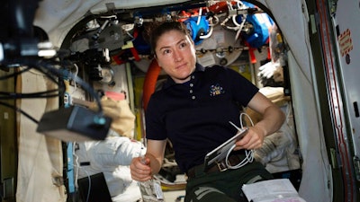 In this April 8, 2019 photo made available by NASA, astronaut and Expedition 59 Flight Engineer Christina Koch works on U.S. spacesuits inside the Quest airlock of the International Space Station. Koch will remain on board until February 2020, approaching but not quite breaking Scott Kelly’s 340-day U.S. record.