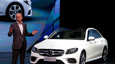 In this Sunday, April 24, 2016 file photo Dieter Zetsche, CEO of the Daimler AG speaks next to the new Mercedes Benz E-Class Long Wheelbase during the world premiere ahead of the Auto China 2016 exhibition in Beijing, China. German carmaker Daimler endured a weak start to the year, echoing troubles at other major manufacturers, as sales in the big Chinese market stuttered.