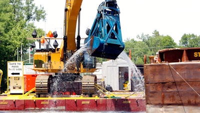 In this June 10, 2011 file photo, crews dredge the Hudson River in Fort Edward, N.Y. The work is part of a project on the upper-Hudson to clean up PCBs released by General Electric decades ago. The Environmental Protection Agency is poised to make an announcement Thursday, April 11, 2019, on GE's $1.7 billion Hudson River cleanup.