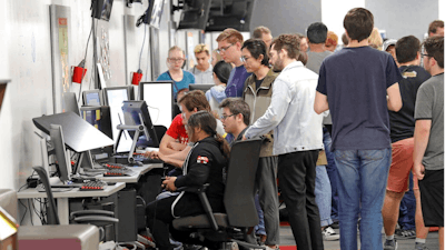 People play new video games during the Entertainment Arts and Engineering Program Launch event at the Master Games Studio on the University of Utah campus Wednesday, April 24, 2019, in Salt Lake City. Drones ferrying medical supplies, packages and even pizza could one day be crisscrossing the skies above U.S. cities, and a team at the University of Utah is working with regulators to keep that traffic in check using a video game.
