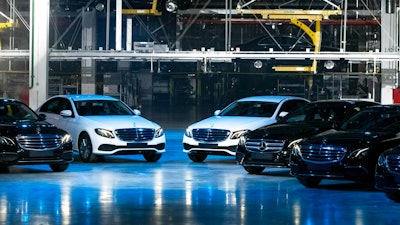 Cars are seen during an opening ceremony of the Mercedes Benz automobile assembly plant outside Moscow, Russia, Wednesday, April 3, 2019. Germany's Daimler AG has opened a new Mercedes factory in Russia, part of a 250 million euro ($281 million) investment it says will create 1,000 jobs.