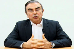 In this image made from a video released by Carlos Ghosn via his lawyer, the former Nissan chairman peaks on camera in Tokyo.