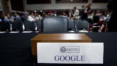 n this Sept. 5, 2018, file photo an empty chair reserved for Google's parent Alphabet, which refused to send its top executive, is seen before the Senate Intelligence Committee hearing on Capitol Hill in Washington.