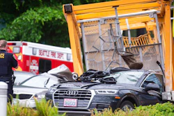 Emergency crews work the scene of a construction crane collapse near the intersection of Mercer Street and Fairview Avenue near Interstate 5 in Seattle, on Saturday, April 27, 2019. Authorities say several people have died and a few others are hospitalized after the construction crane fell onto a street in downtown Seattle Saturday afternoon.