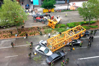 Fire and police crew members work to clear the scene where a construction crane fell from a building on Google's new Seattle campus crashing down onto one of the city's busiest streets and killing multiple people on Saturday, April 27, 2019.