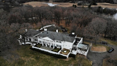 This aerial photo shows Irwin Jacobs home in Orono, Minn., Wednesday, April 10, 2019. Authorities are investigating the deaths of two people found at the Lake Minnetonka mansion of Irwin Jacobs, a prominent Minnesota businessman who once owned a minority share in the Minnesota Vikings NFL team.