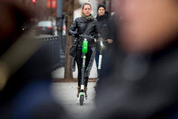 In this Dec. 4, 2018, photo a couple rides scooters near the White House in Washington. Electric scooters are overtaking station-based bicycles as the most popular form of shared transportation outside transit and cars.