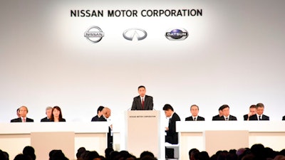 In this photo released by Nissan Motor Co., Nissan Chief Executive Hiroto Saikawa, center, speaks at the company's shareholders' meeting in Tokyo Monday, April 8, 2019. Nissan shareholders approved on Monday the ouster from the Japanese automaker's board former Chairman Carlos Ghosn, who faces allegations of financial misconduct.