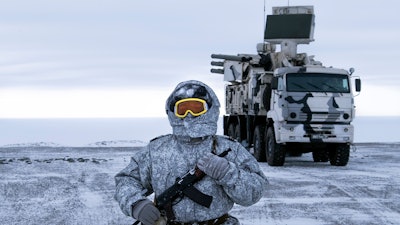 A Russian solder stands guard by the Pansyr-S1 air defense system on the Kotelny Island, part of the New Siberian Islands archipelago located between the Laptev Sea and the East Siberian Sea, Russia. Russia has made reaffirming its military presence in the Arctic the top priority amid an intensifying international rivalry over the region.