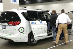 A person gets into a self-driving Chrysler Pacifica Hybrid Friday, April 5, 2019, in Detroit. Hundreds from the general public are signed up for the six-minute journey that leads riders through a course set up inside a Detroit convention center, as part of an effort to clear up misunderstandings and confusion about the technology.