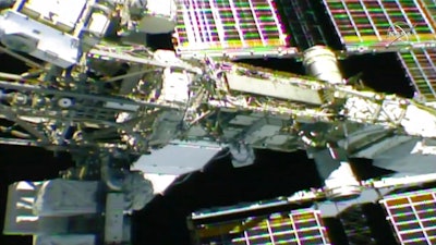 In this photo provided by NASA, NASA astronaut Anne McClain works outside the International Space Station, Monday, April 8, 2019. McClain and Canadian astronaut David Saint-Jacques got an early start Monday morning as they tackled battery and cable work outside the International Space Station. It's the third spacewalk in just 2 ½ weeks for the station crew.