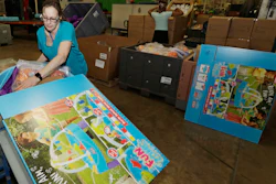 In this photo Kelly Schubert loads a Battle Splash Water Tank into a box at the The Little Tikes Company in Hudson, Ohio. A year after Toys R Us imploded, toy makers are still adjusting.