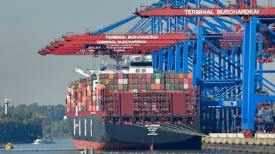 In this Monday, Oct. 15, 2018 file photo, a container ship is loaded at the harbor in Hamburg, Germany. The United States is considering putting tariffs on $11 billion in EU goods per year to offset what it says are unfair European subsidies for planemaker Airbus. While the size of the potential tariffs is relatively small compared with the hundreds of billions of goods the U.S. and China are taxing in their trade war, it suggests a breakdown in talks with the EU over trade.
