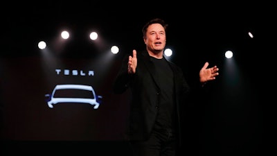 In this March 14, 2019, file photo Tesla CEO Elon Musk speaks before unveiling the Model Y at Tesla's design studio in Hawthorne, Calif. Musk appears poised to transform the company’s electric cars into driverless vehicles in a risky bid to realize a bold vision that he has been floating for years. The technology required to make that quantum leap is scheduled to be shown off to Tesla investors Monday, April 22, 2019, at the company’s Palo Alto, Calif., headquarters.
