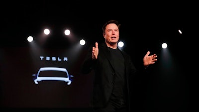 In this March 14, 2019, file photo Tesla CEO Elon Musk speaks before unveiling the Model Y at Tesla's design studio in Hawthorne, Calif. Musk appears poised to transform the company’s electric cars into driverless vehicles in a risky bid to realize a bold vision that he has been floating for years. The technology required to make that quantum leap is scheduled to be shown off to Tesla investors Monday, April 22, 2019, at the company’s Palo Alto, Calif., headquarters.