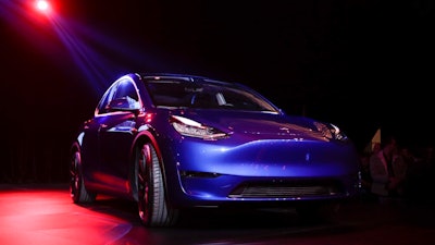 In this March 14, 2019, file photo the Tesla Model Y is unveiled at Tesla's design studio in Hawthorne, Calif. Tesla, Inc. reports earnings Wednesday, April 24.