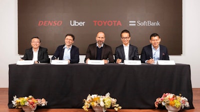 In this Thursday, April 18, 2019, photo provided by Toyota Motor Corporation, from left, Denso Corp. Executive Vice President Hiroyuki Wakabayashi, Head of Uber ATG Eric Meyhofer, CEO of Uber Technologies, Inc. Dara Khosrowshahi, Toyota Executive Vice President Shigeki Tomoyama and Managing Partner of Softbank Vision Fund Ervin Tu attend a press conference at Uber headquarters in San Francisco. Japan's top automaker Toyota, auto parts maker Denso and internet company SoftBank's investment fund are investing $1 billion in car-sharing Uber's technology unit.