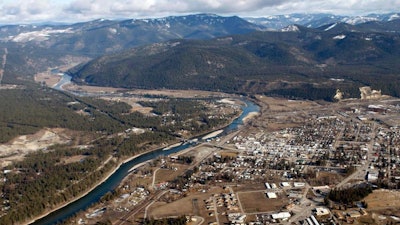 This Feb. 17, 2010, aerial file photo, shows the town of Libby Mont. Environmental officials say a portion of a northwestern Montana town's asbestos cleanup has been completed and will be removed from the federal Superfund list. The 45-acre area removed from the National Priorities List, Wednesday, April 10, 2019, is 5 miles north of downtown Libby, and it is only one of eight units of the Libby Asbestos Superfund site.