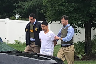 Xiaoqing Zheng has remained free on bond after he was arrested on Aug. 1, 2018.
