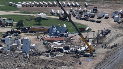 This April 2013, file photo, shows damage from the West, Texas, fertilizer plant explosion as seen from helicopters as President Barack Obama traveled to a memorial in Waco, Texas. Ceremonies will be held this weekend in the Central Texas town to remember the 15 people killed in the plant fire and explosion. Organizers say the City of West Fallen Heroes Memorial will be dedicated Saturday. The 2013, blast at the West Fertilizer Co. plant claimed the lives of a dozen emergency personnel and three residents of West, a town of about 3,000 located 65 miles south of Dallas.