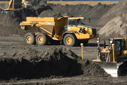 In this Nov. 14, 2017 file photo, crews with Duke Energy continue to remove coal ash from the old coal ponds at the Sutton Plant, in Wilmington, N.C. Duke Energy Corp., the country’s largest electric company, was ordered Monday, April 1, 2019 to excavate coal ash from all of its North Carolina power plant sites, slashing the risk of toxic chemicals leaking into water supplies but potentially adding billions of dollars to the costs consumers pay.