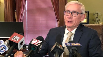 Wisconsin Gov. Tony Evers says he thinks it's 'unrealistic' for Foxconn Technology Group to employ 13,000 people in the state and he wants to renegotiate the contract during a news conference Wednesday, April 17, 2019, in Madison, Wisconsin. Evers told reporters that the state was working with Taiwan-based Foxconn to look at revising the original contract for the proposed facility to build liquid crystal display panels because it 'deals with a situation that no longer exists.'