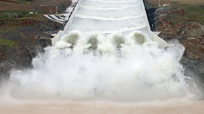 Water flows down the Oroville Dam spillway in Oroville, Calif., Tuesday, April 2, 2019. California officials opened the flood-control spillway at the nation's tallest dam for the first time since it was rebuilt after it crumbled during heavy rains two years ago.